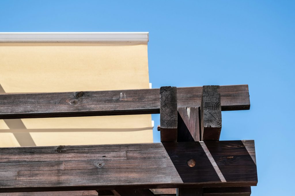 brown wooden fence under blue sky during daytime